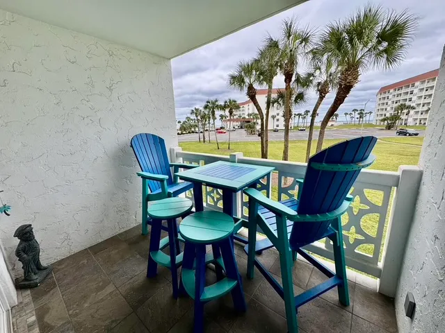 a view of a room with furniture and a potted plant