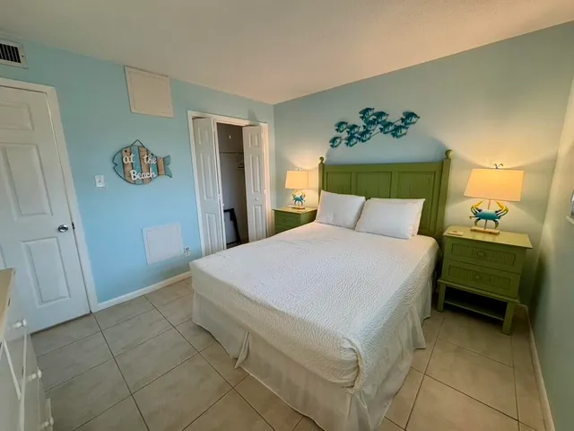 a bedroom with a bed and a table