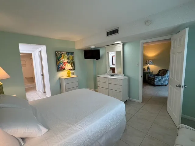 a bedroom with a bed and furniture