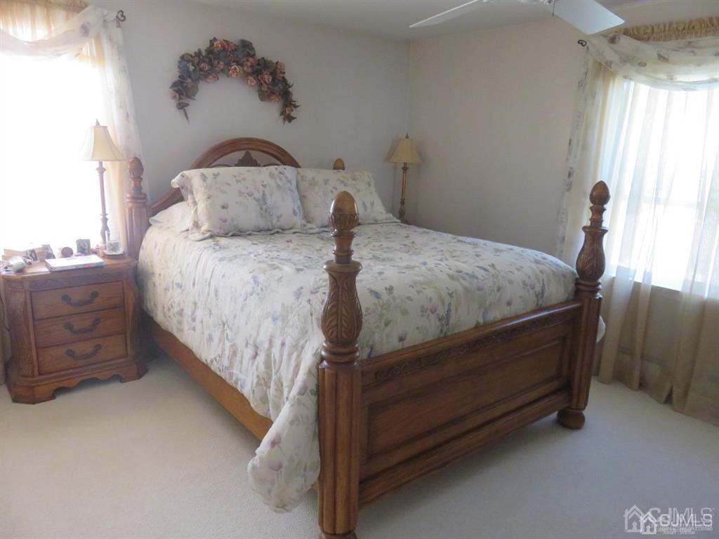 367 Eagle Avenue Perth Amboy, NJ 08861 - Photo 11 of 25 a bed sitting in a bedroom next to a window