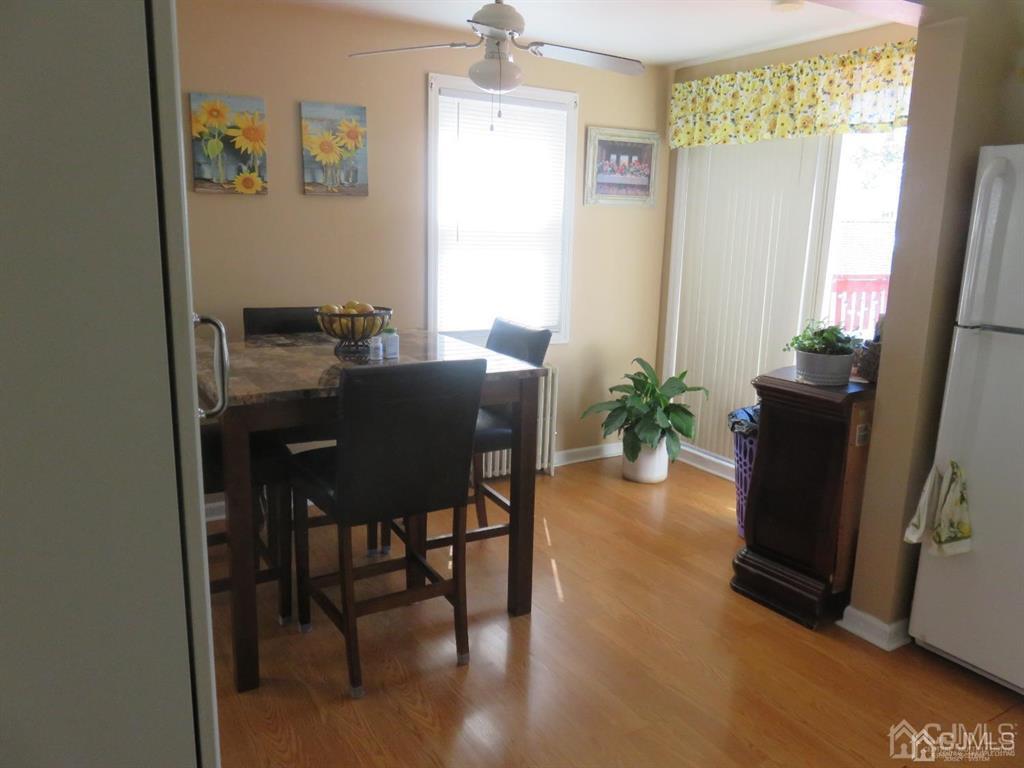 367 Eagle Avenue Perth Amboy, NJ 08861 - Photo 18 of 25 a view of a dining room with furniture window and wooden floor