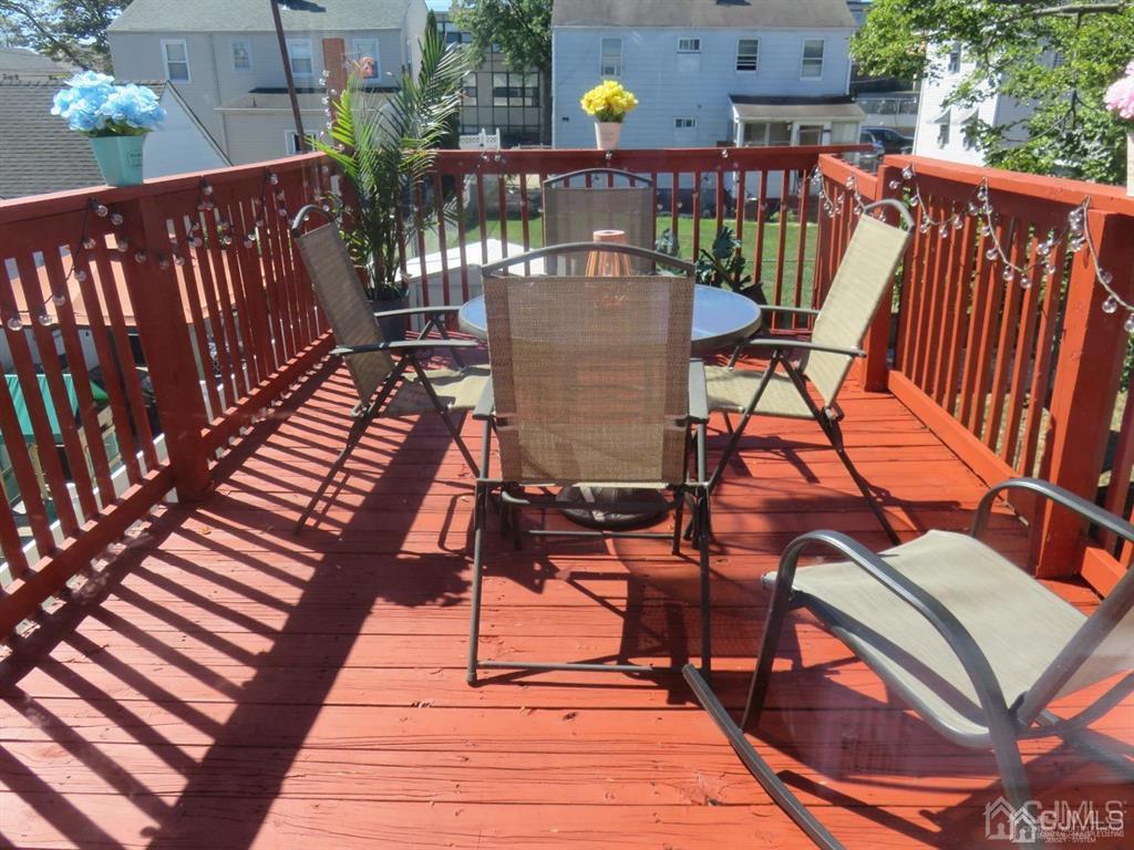 367 Eagle Avenue Perth Amboy, NJ 08861 - Photo 20 of 25 a view of balcony with wooden floor outdoor seating and wooden floor