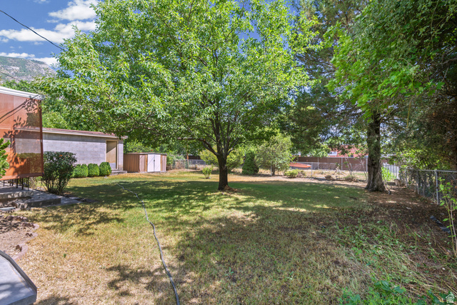542 East 3400th Street North Provo, UT 84604 - Photo 25 of 39 Expansive backyard featuring a mature deciduous tree providing shade