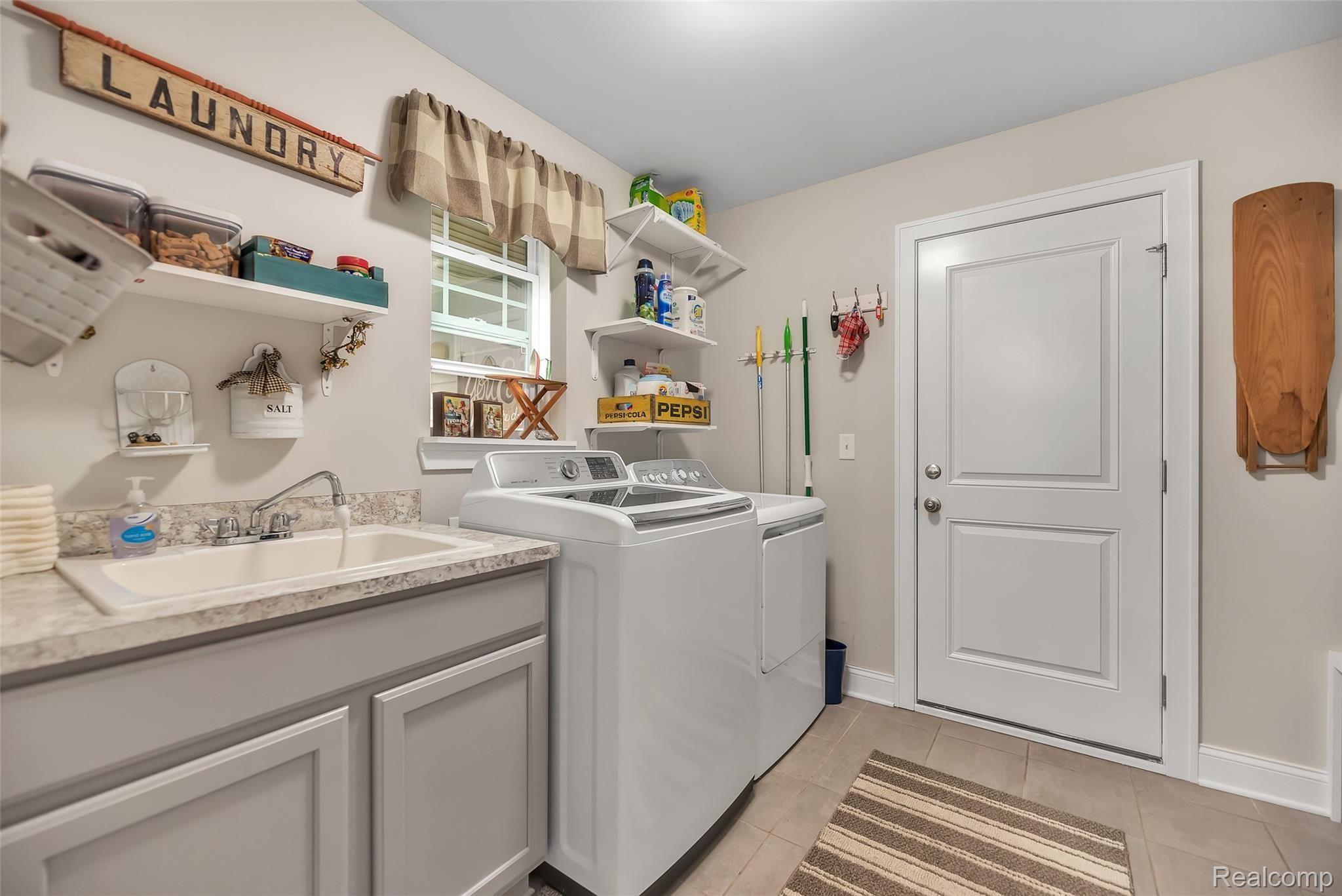 103 Sedum Road Howell, MI 48843 - Photo 14 of 30 Big Laundry Room Off The Attached Garage