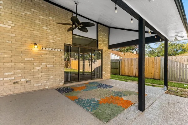 a view of a house with backyard and porch