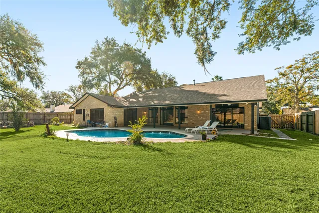 a view of a house with a yard porch and sitting area