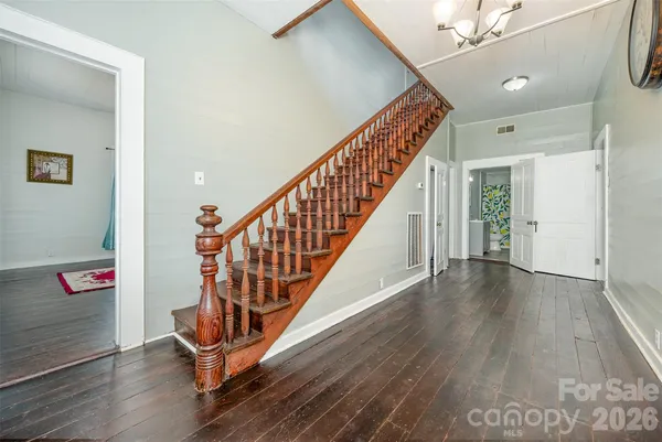 a view of an entryway with wooden floor