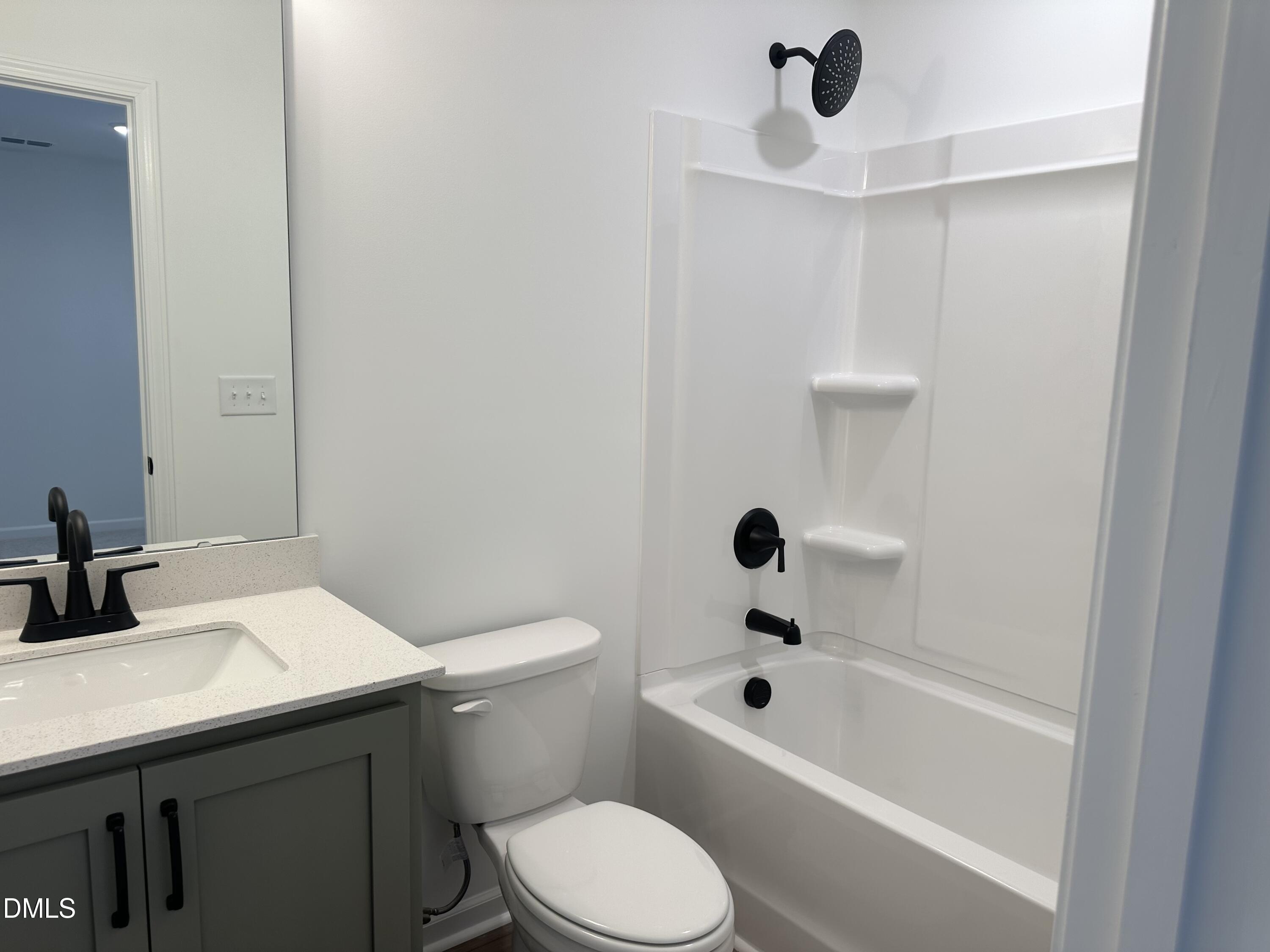 1526 Mirth Court Rolesville, NC 27571 - Photo 21 of 34 a bathroom with a sink a toilet and shower