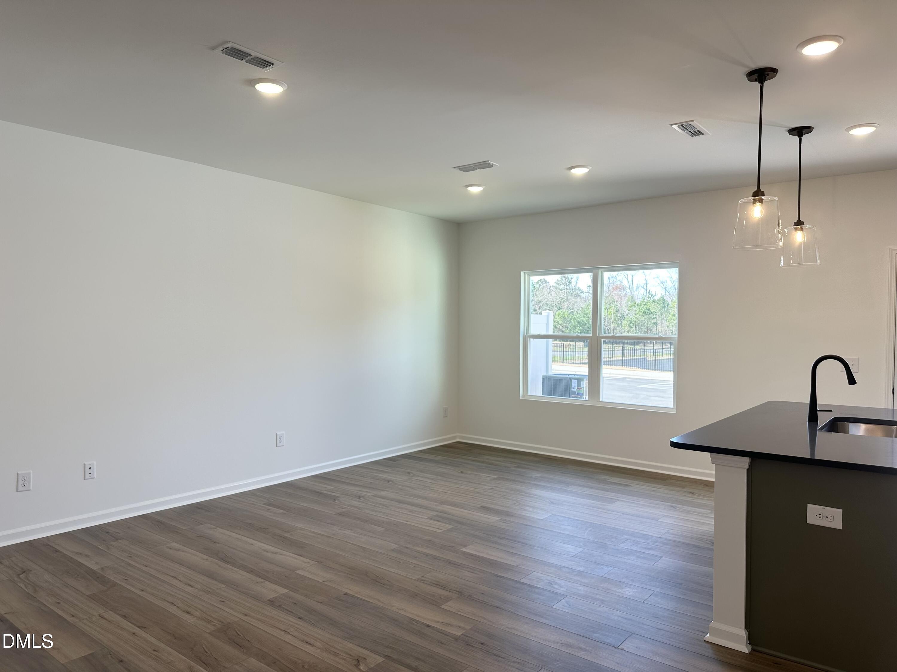 1526 Mirth Court Rolesville, NC 27571 - Photo 7 of 34 a view of a room with a ceiling fan and window