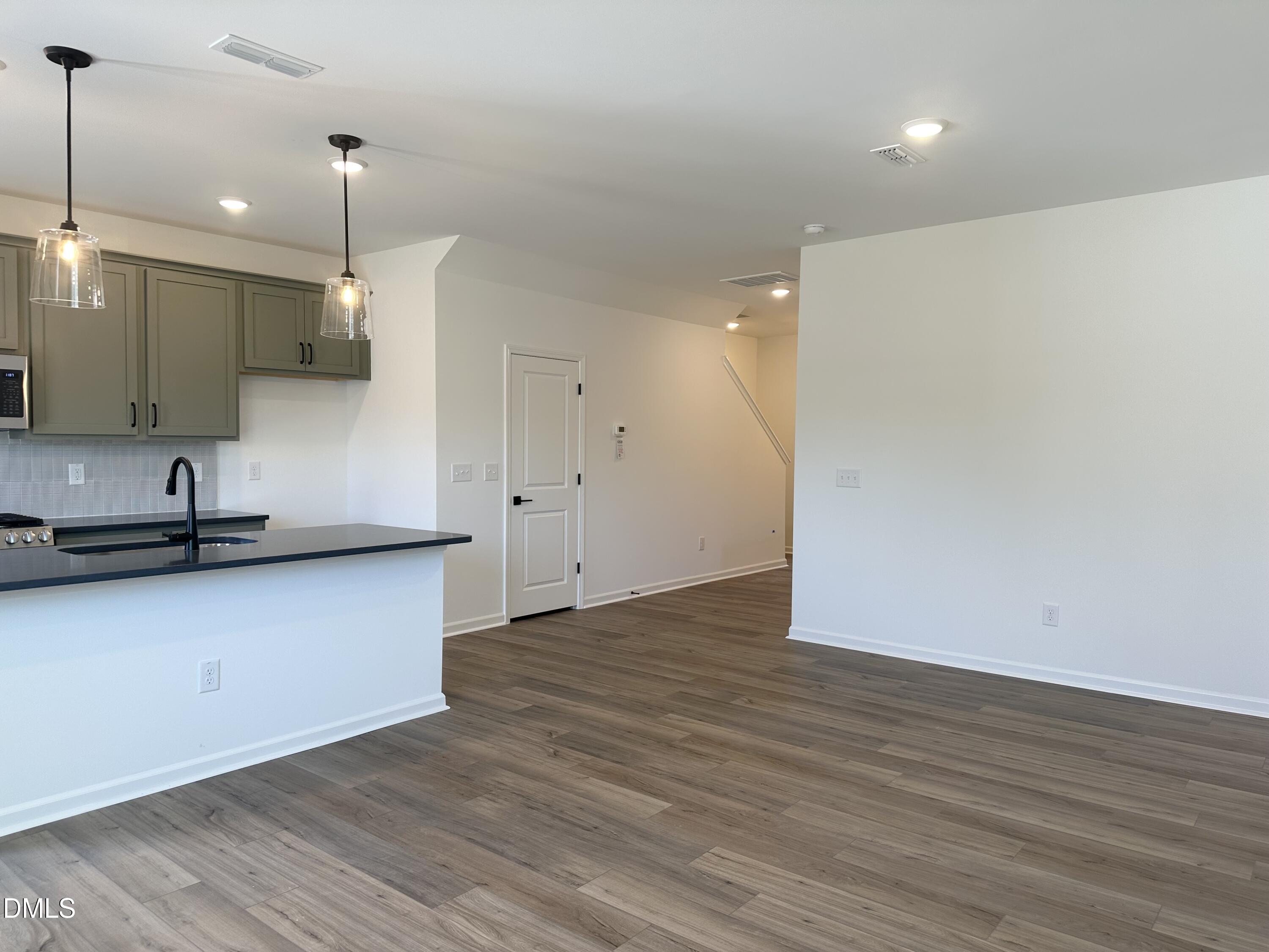 1526 Mirth Court Rolesville, NC 27571 - Photo 9 of 34 a view of kitchen with wooden floor and window