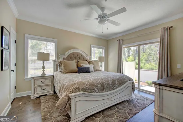 a bedroom with a large bed and a window