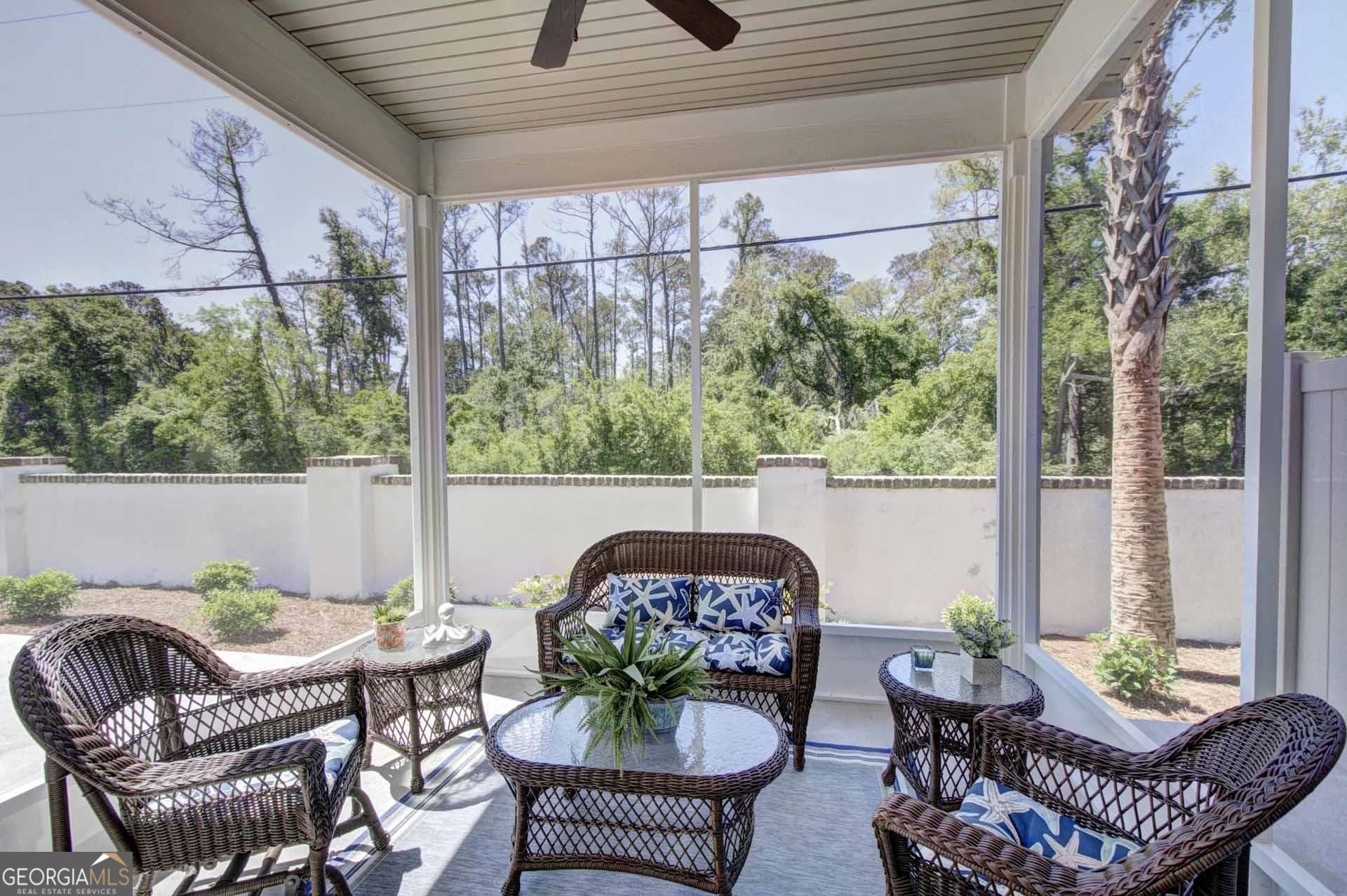 205 Mariners Circle St. Simons, GA 31522 - Photo 21 of 51 a balcony with furniture and a potted plant