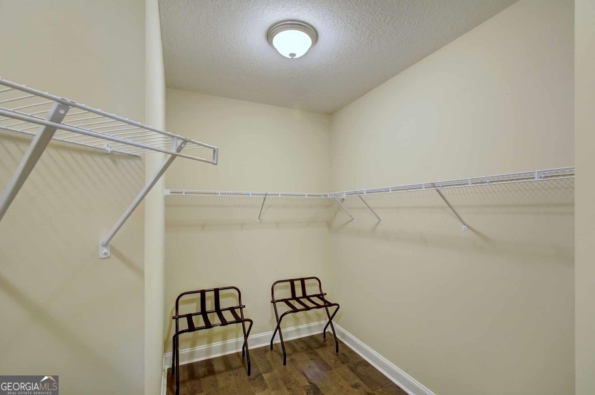 205 Mariners Circle St. Simons, GA 31522 - Photo 28 of 51 a view of a room with racks on the wall