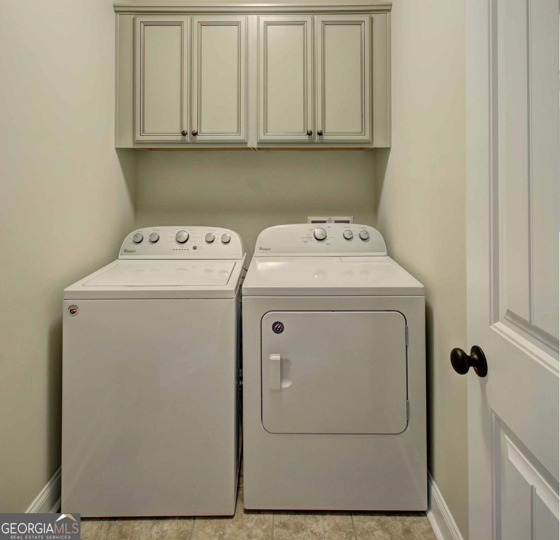 205 Mariners Circle St. Simons, GA 31522 - Photo 29 of 51 a utility room with dryer and washer