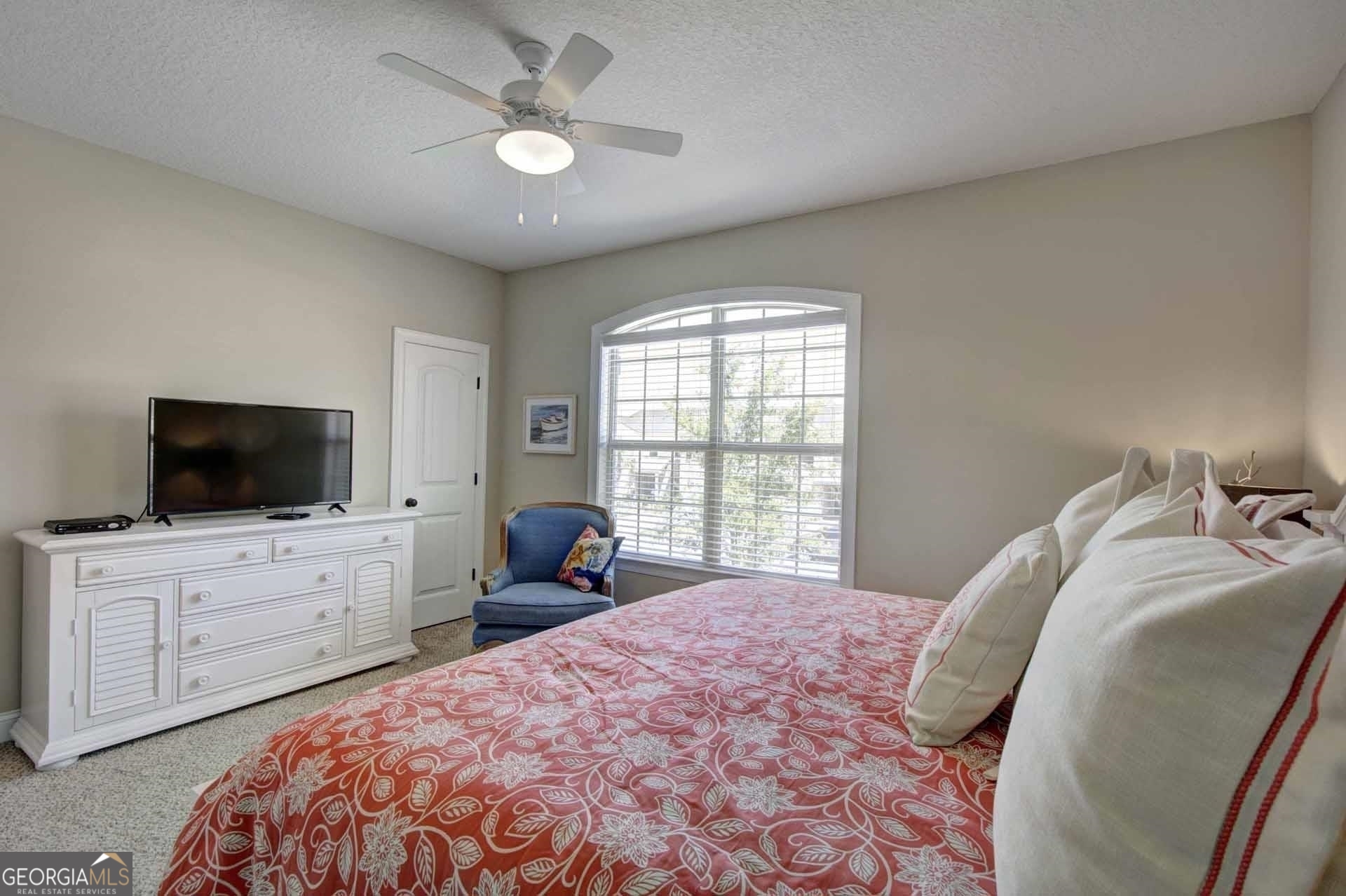 205 Mariners Circle St. Simons, GA 31522 - Photo 32 of 51 a bedroom with a bed and a flat screen tv