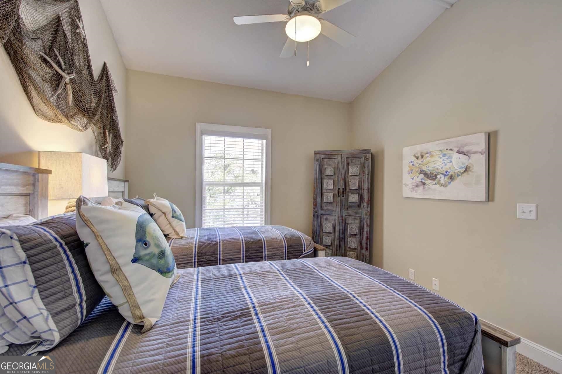 205 Mariners Circle St. Simons, GA 31522 - Photo 35 of 51 a bedroom with a large bed and a window