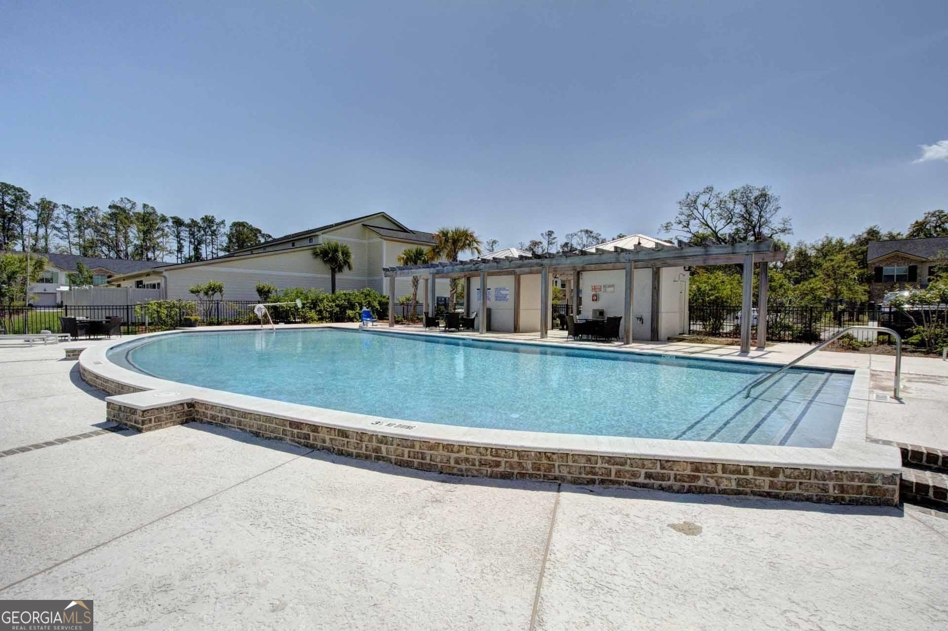 205 Mariners Circle St. Simons, GA 31522 - Photo 40 of 51 a view of swimming pool with outdoor seating and city view