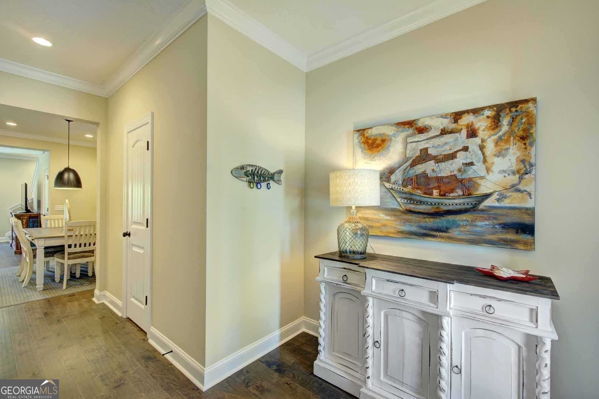 205 Mariners Circle St. Simons, GA 31522 - Photo 5 of 51 a view of a hallway to room with furniture and wooden floor