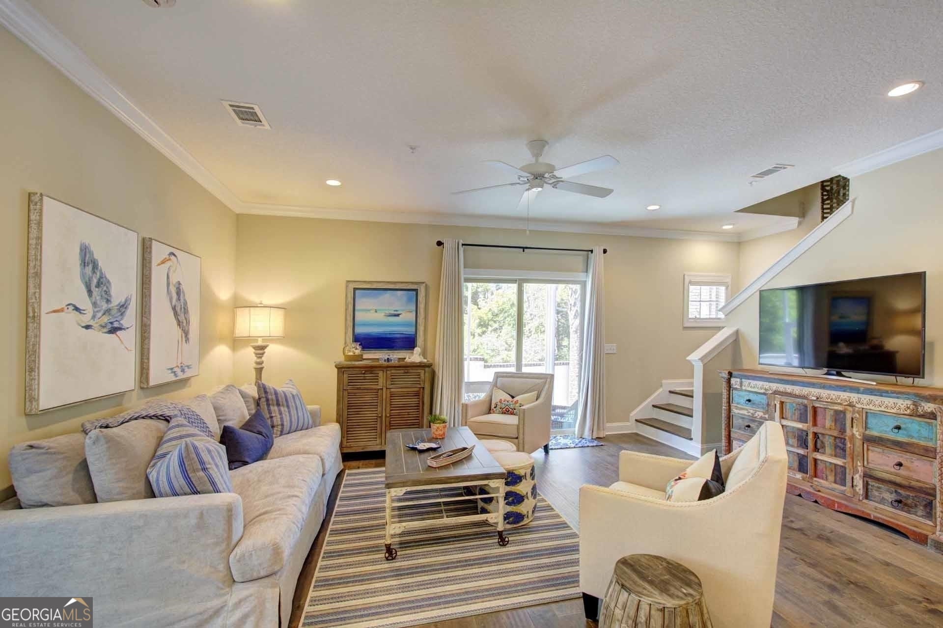 205 Mariners Circle St. Simons, GA 31522 - Photo 7 of 51 a living room with furniture and a flat screen tv