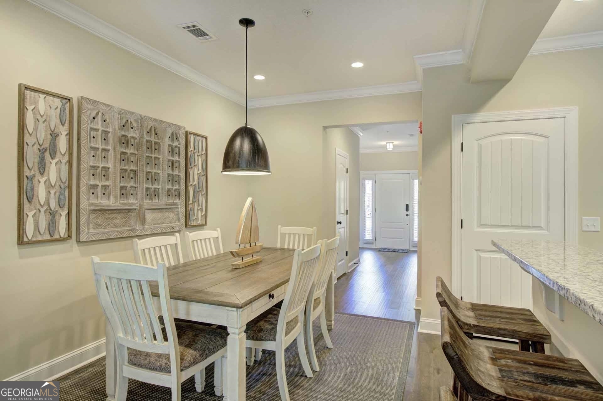 205 Mariners Circle St. Simons, GA 31522 - Photo 8 of 51 a view of a dining room with furniture window and wooden floor