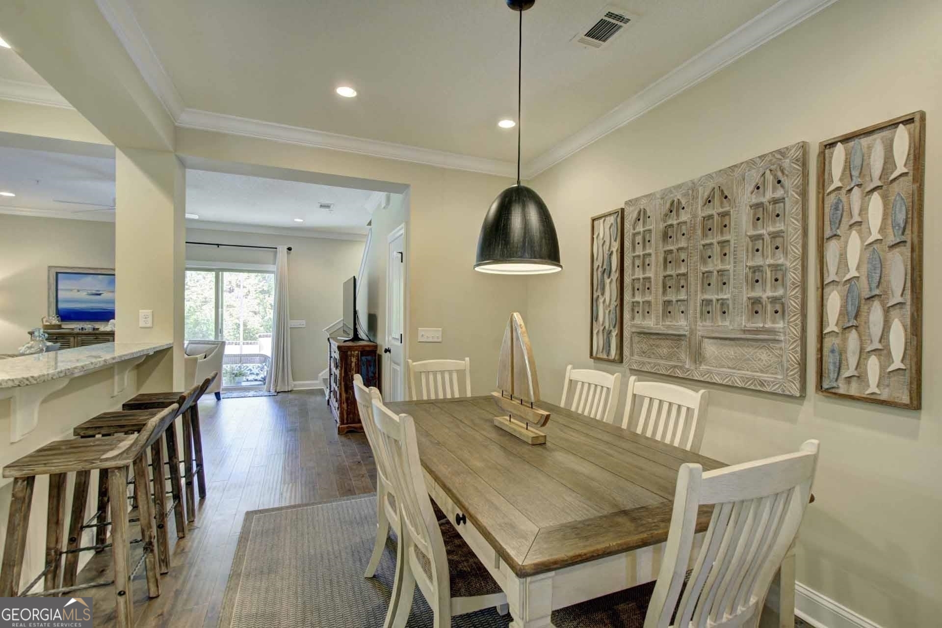 205 Mariners Circle St. Simons, GA 31522 - Photo 9 of 51 a dining room with furniture and wooden floor