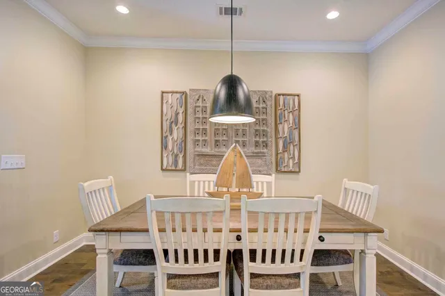 a view of dining room and wooden floor
