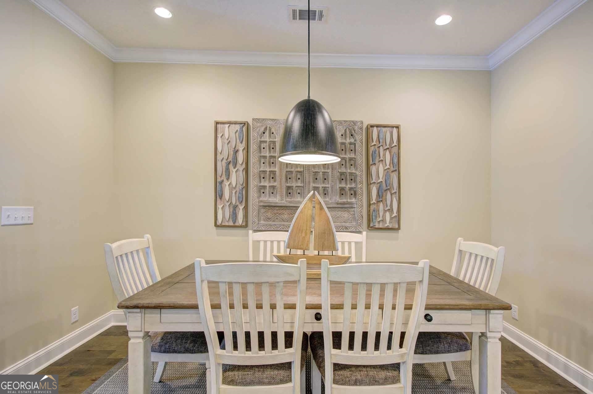 205 Mariners Circle St. Simons, GA 31522 - Photo 10 of 51 a view of dining room and wooden floor