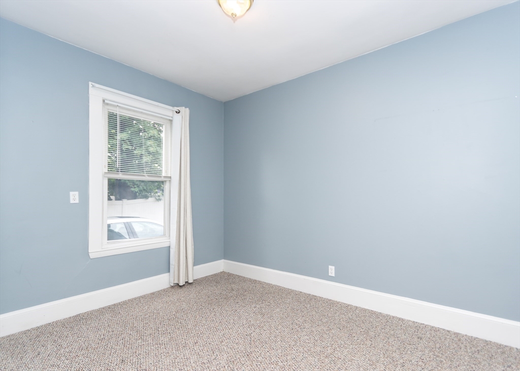 21 Gardner Street, Unit 1 Waltham, MA 02453 - Photo 15 of 19 an empty room with windows