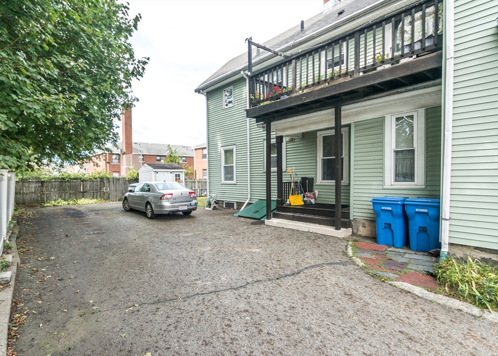 21 Gardner Street, Unit 1 Waltham, MA 02453 - Photo 19 of 19 a view of a house with truck parked on the road