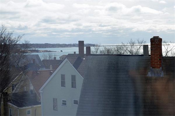 28 Washington Square Gloucester, MA 01930 - Photo 3 of 26 a view of a lake with a city