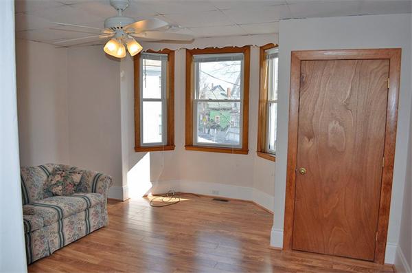 28 Washington Square Gloucester, MA 01930 - Photo 8 of 26 a living room with furniture and a window