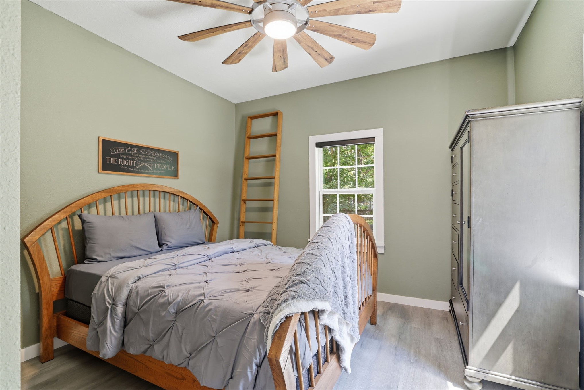 210 Main Caddo, OK 74729 - Photo 7 of 30 Room featuring light green walls and wood-finish flooring