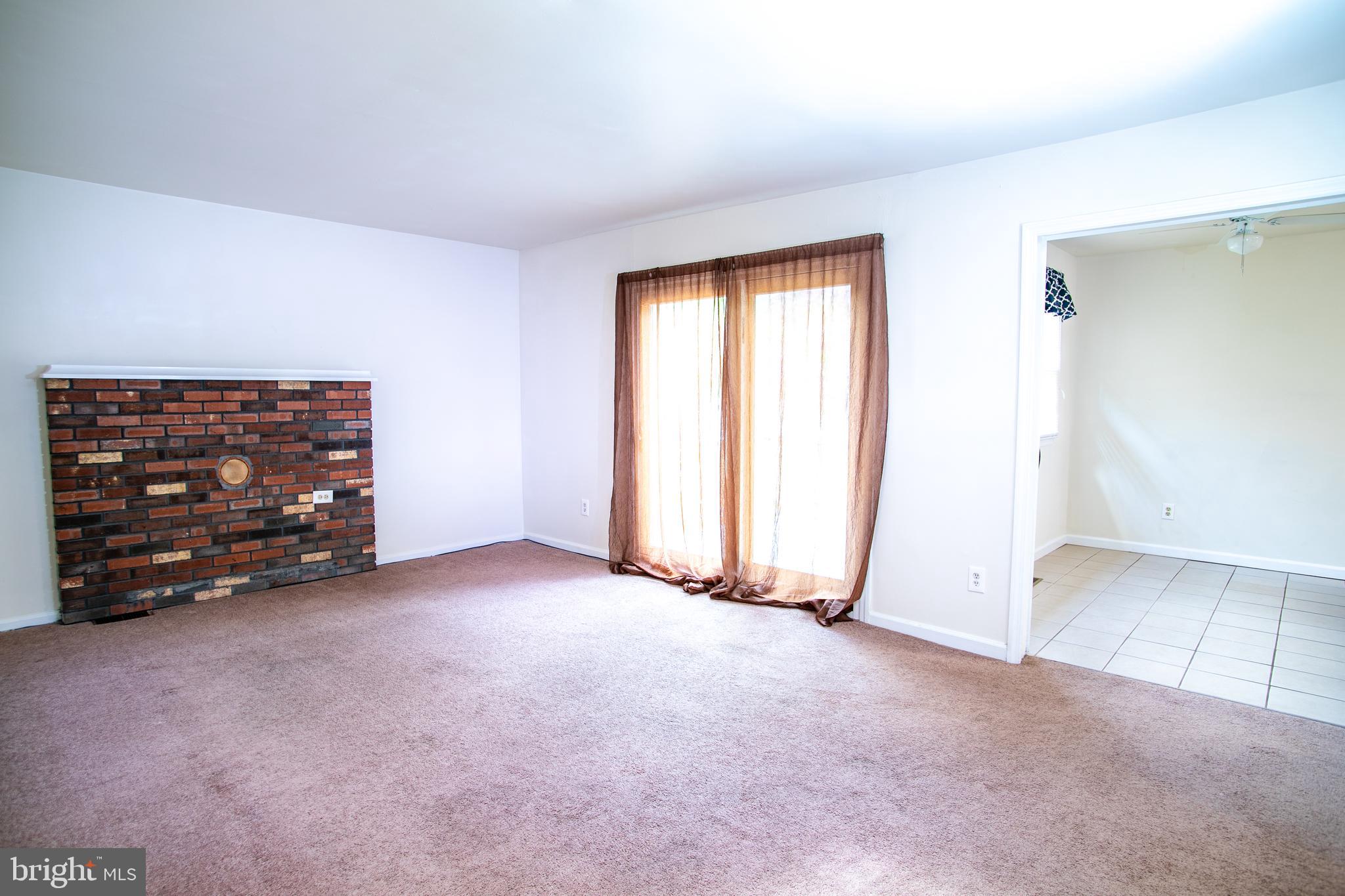 613 New York Road Glassboro, NJ 08028 - Photo 17 of 27 an empty room with furniture and a window