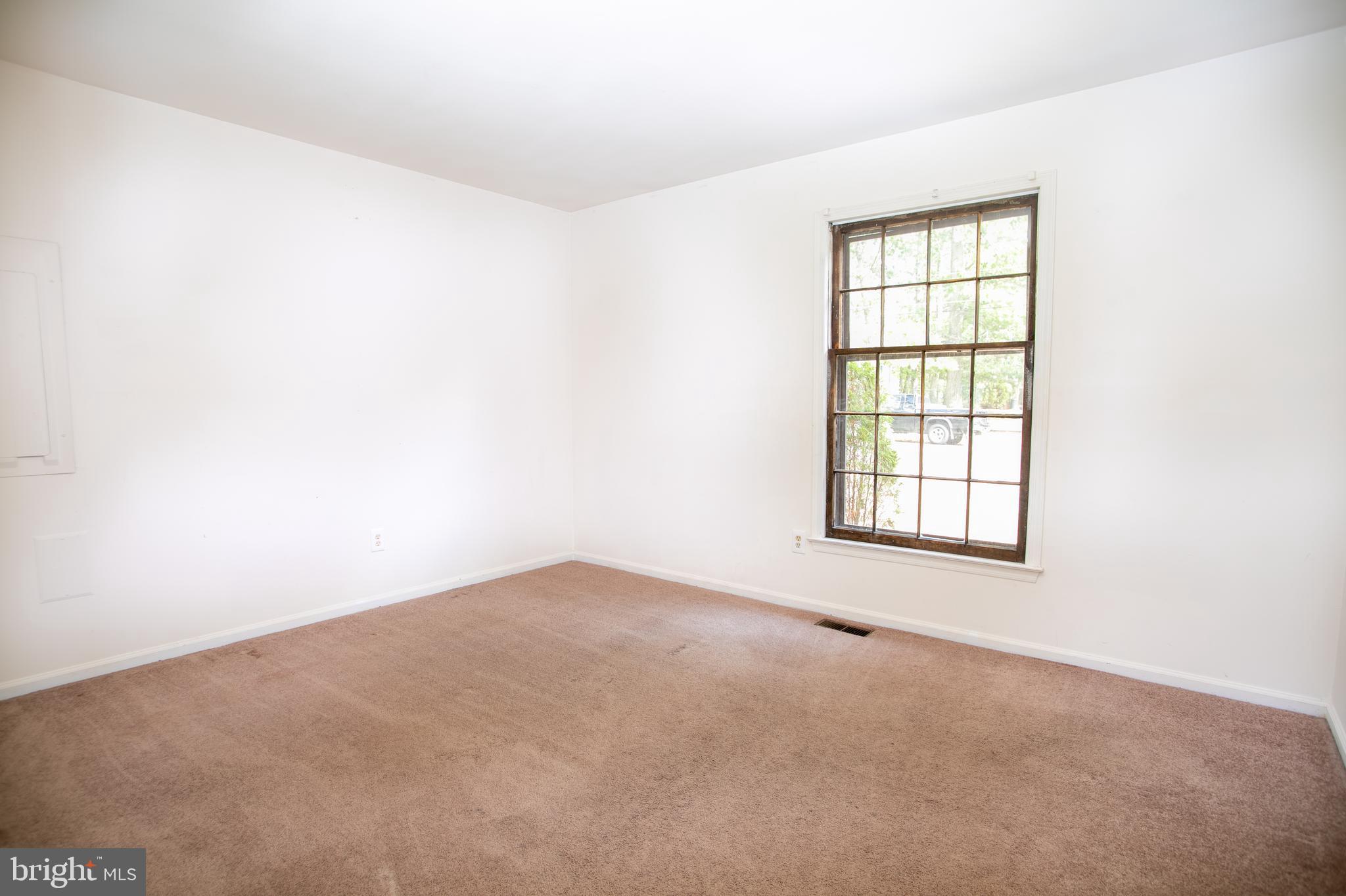 613 New York Road Glassboro, NJ 08028 - Photo 22 of 27 an empty room with windows