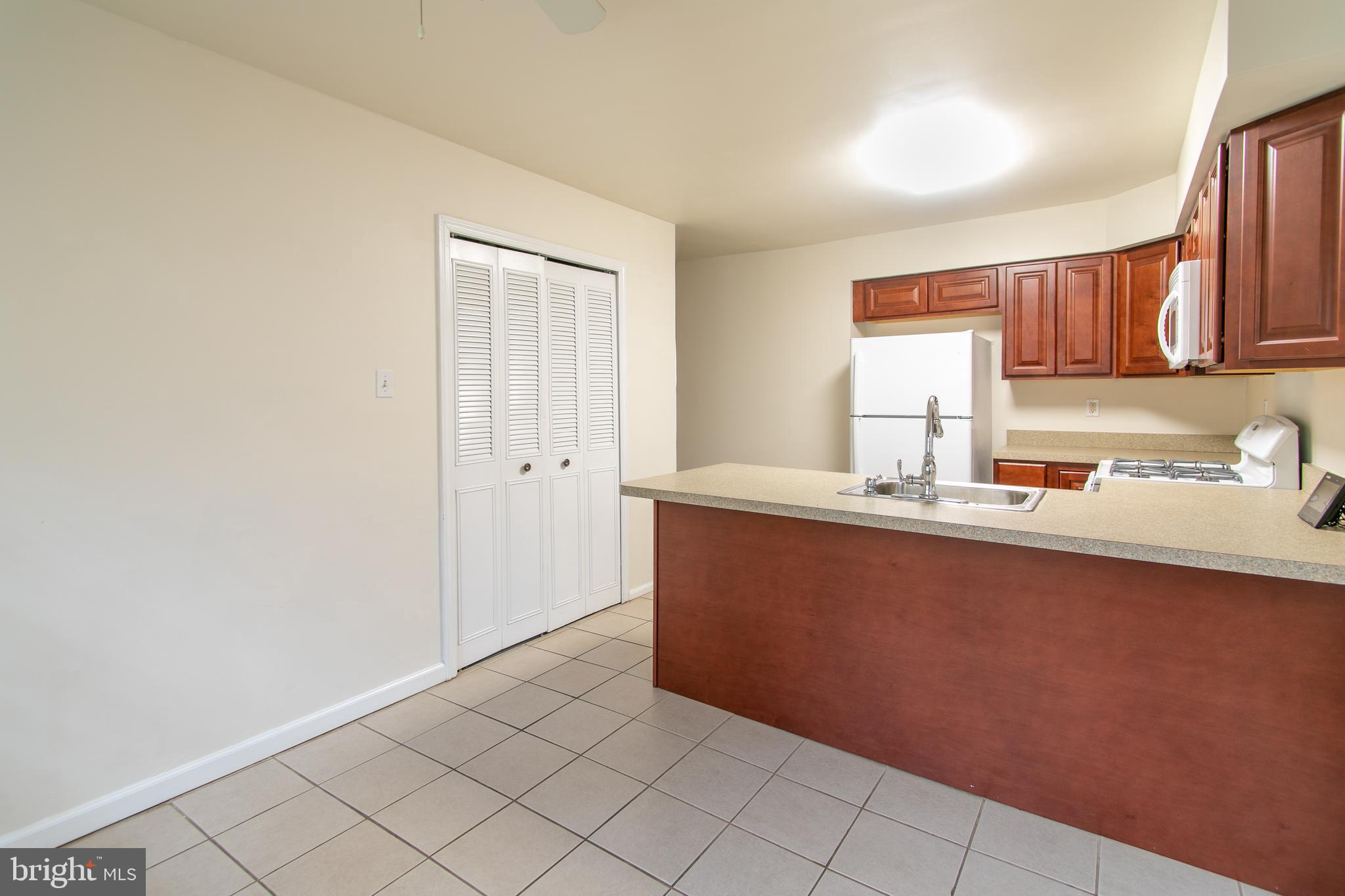 613 New York Road Glassboro, NJ 08028 - Photo 9 of 27 a kitchen with granite countertop white cabinets and sink