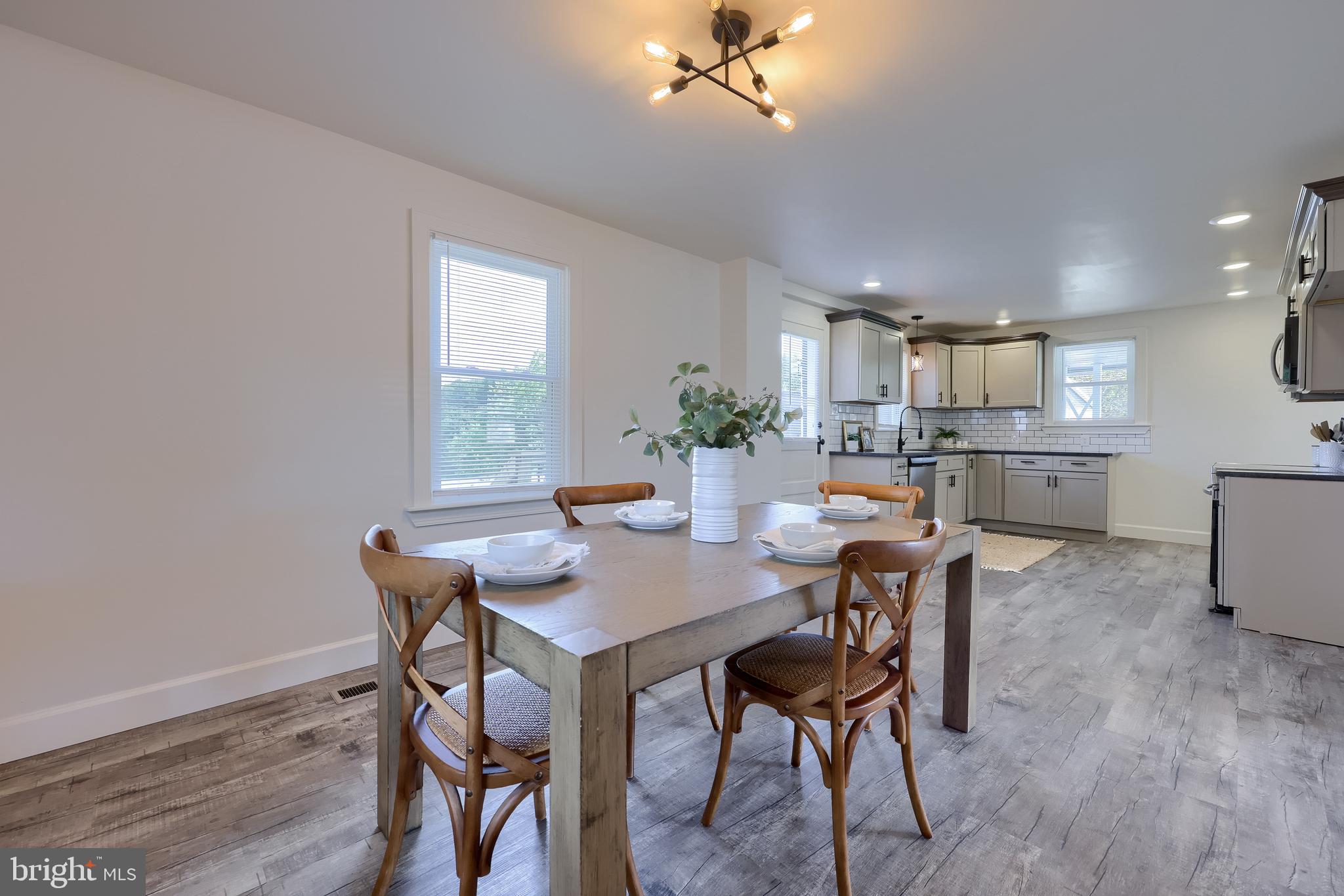 1151 Delta Road Red Lion, PA 17356 - Photo 11 of 44 a view of a dining room with furniture and wooden floor