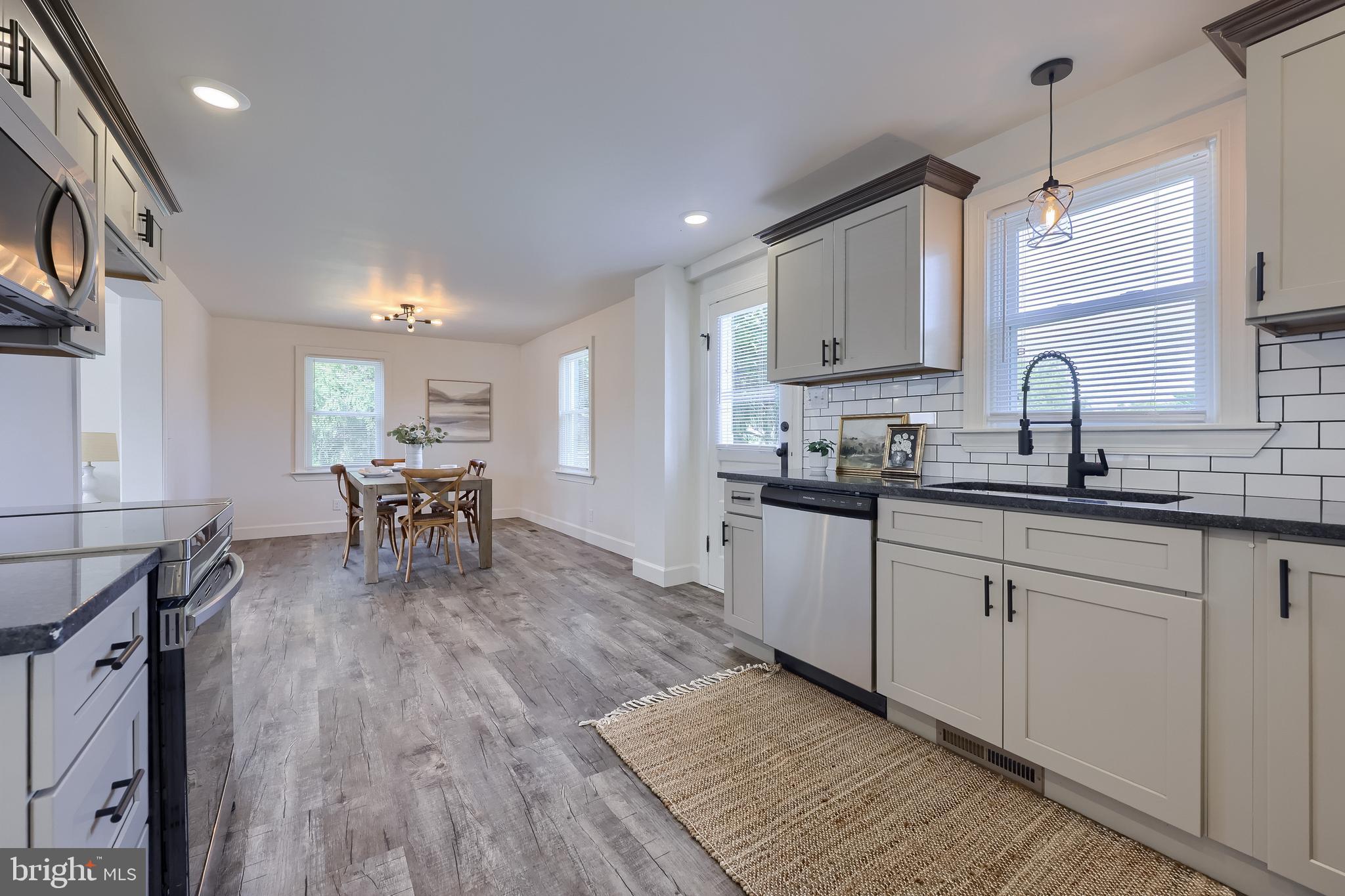1151 Delta Road Red Lion, PA 17356 - Photo 14 of 44 a kitchen with sink cabinets and wooden floor