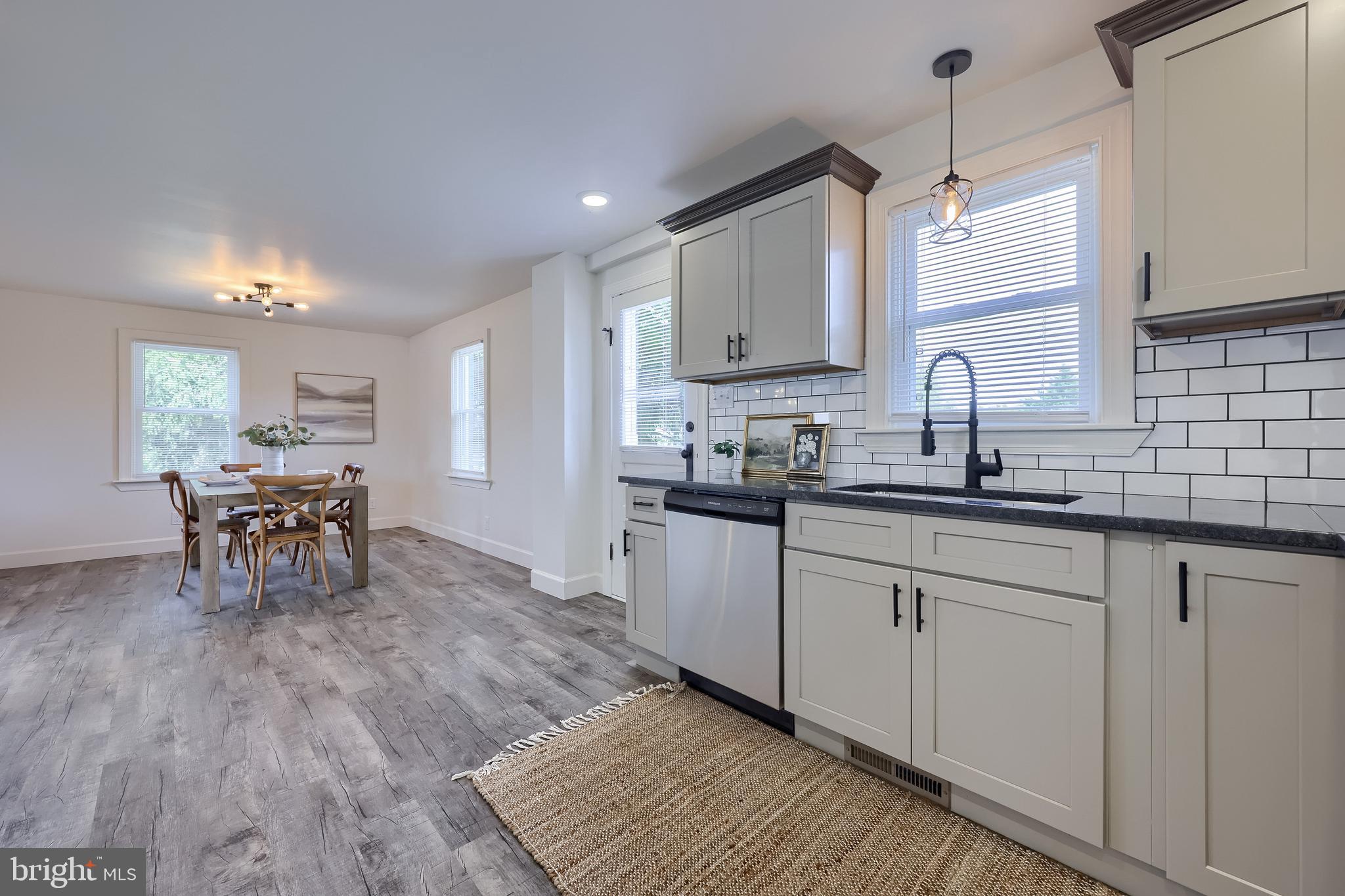 1151 Delta Road Red Lion, PA 17356 - Photo 16 of 44 a kitchen with sink cabinets and dining table
