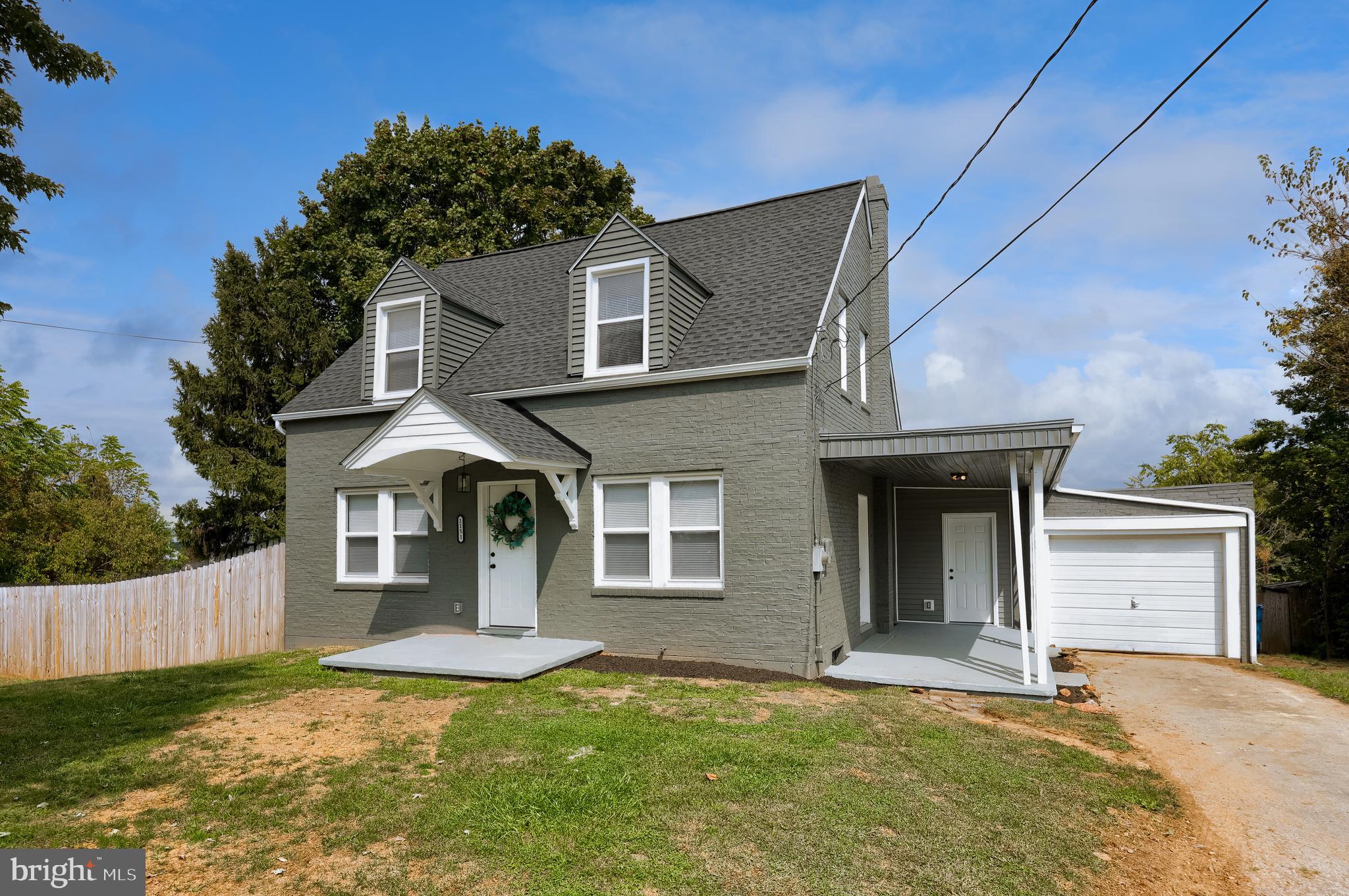 1151 Delta Road Red Lion, PA 17356 - Photo 37 of 44 a front view of a house with yard and garage