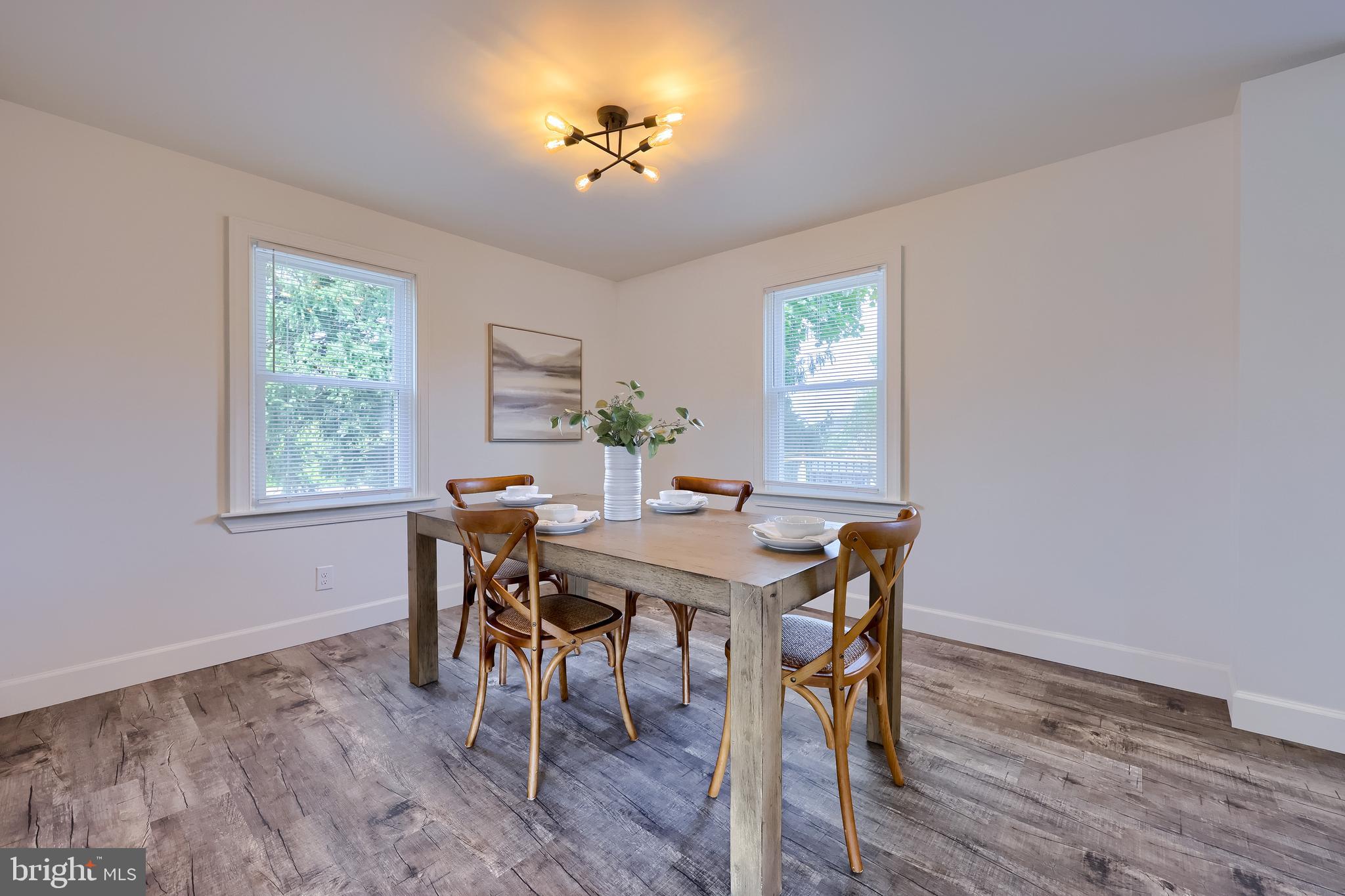 1151 Delta Road Red Lion, PA 17356 - Photo 9 of 44 a view of a dining room with furniture a chandelier and wooden floor