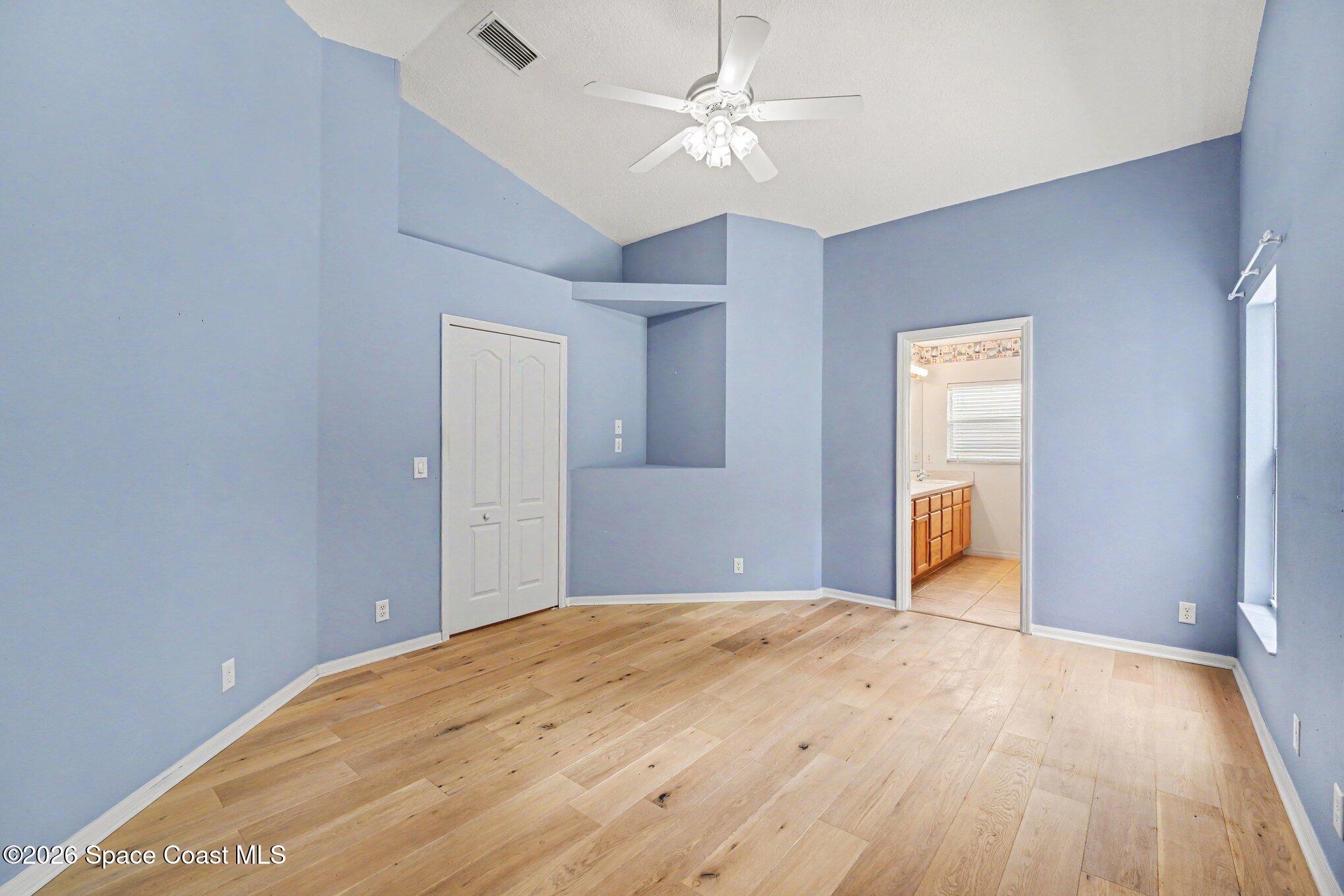 2194 Spring Creek Circle Palm Bay, FL 32905 - Photo 12 of 40 Primary Bedroom Suite