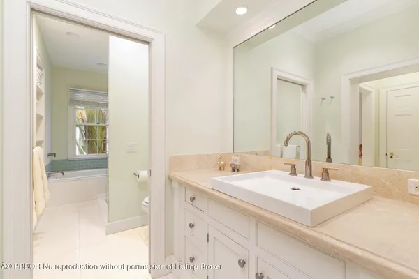 a bathroom with a sink and mirror