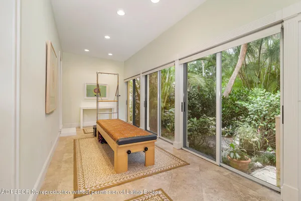 a living room with furniture a rug and a large window