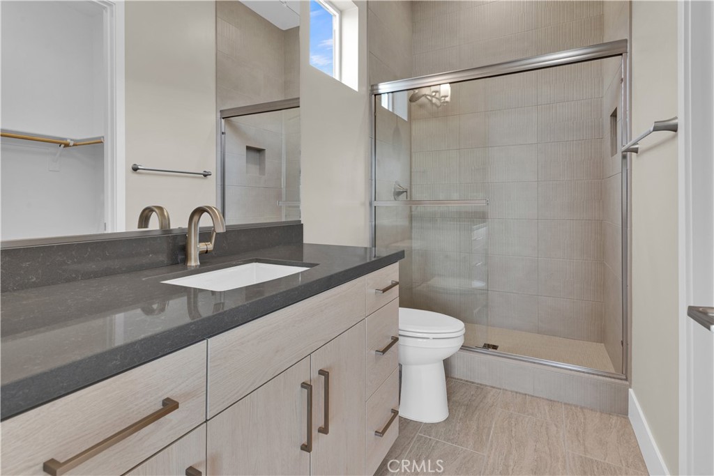 1330 Cava Road Paso Robles, CA 93446 - Photo 11 of 14 a bathroom with a sink a toilet a shower and a mirror