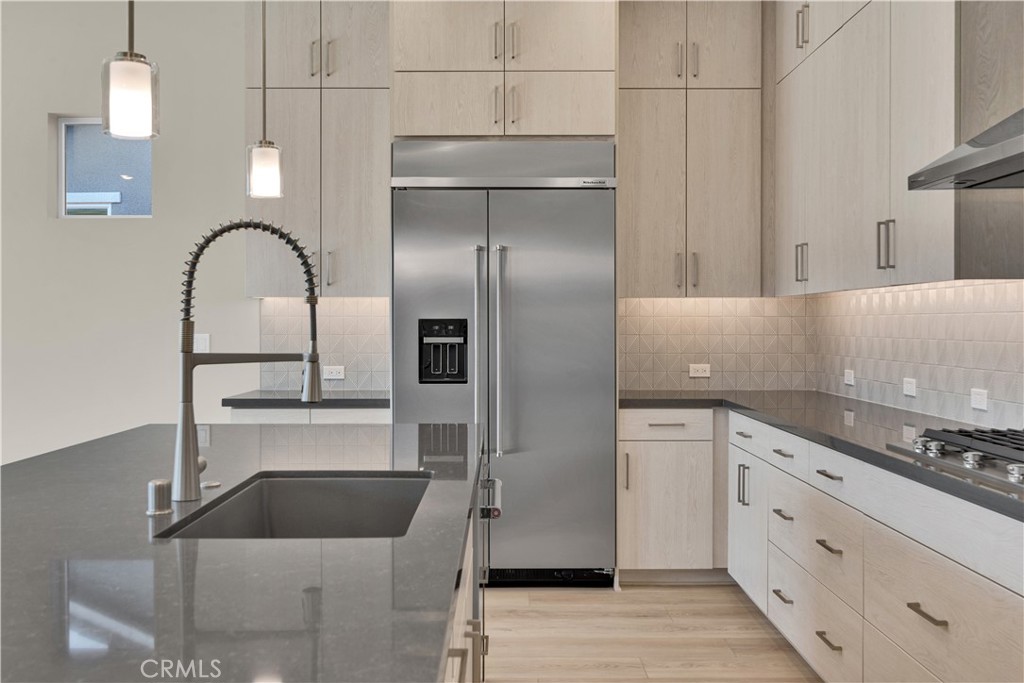 1330 Cava Road Paso Robles, CA 93446 - Photo 3 of 14 a kitchen with a refrigerator sink and cabinets