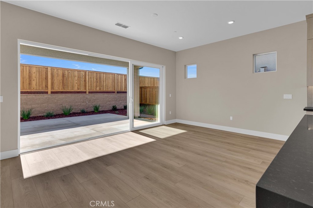 1330 Cava Road Paso Robles, CA 93446 - Photo 5 of 14 a view of an empty room with wooden floor and a window