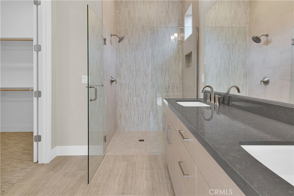 1330 Cava Road Paso Robles, CA 93446 - Photo 9 of 14 a bathroom with a double vanity sink and mirror