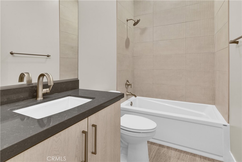 1330 Cava Road Paso Robles, CA 93446 - Photo 10 of 14 a bathroom with a granite countertop sink a toilet and bathtub