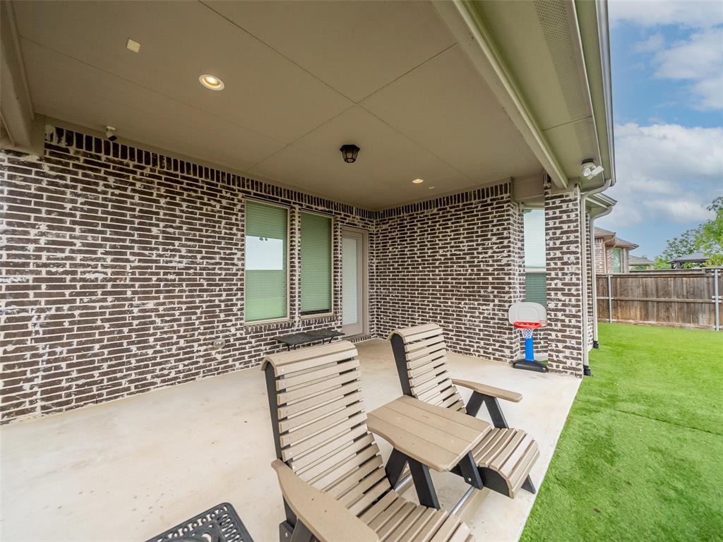 3044 Bold Ruler Road Celina, TX 75009 - Photo 25 of 36 a front view of a house with garden