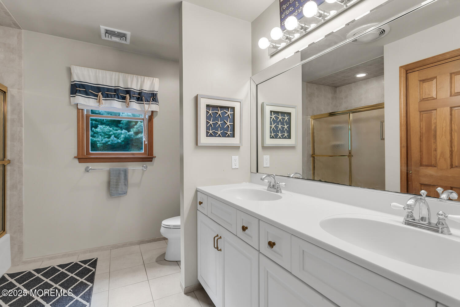 5 Page Drive Red Bank, NJ 07701 - Photo 17 of 27 a bathroom with a double vanity sink a toilet a mirror and shower